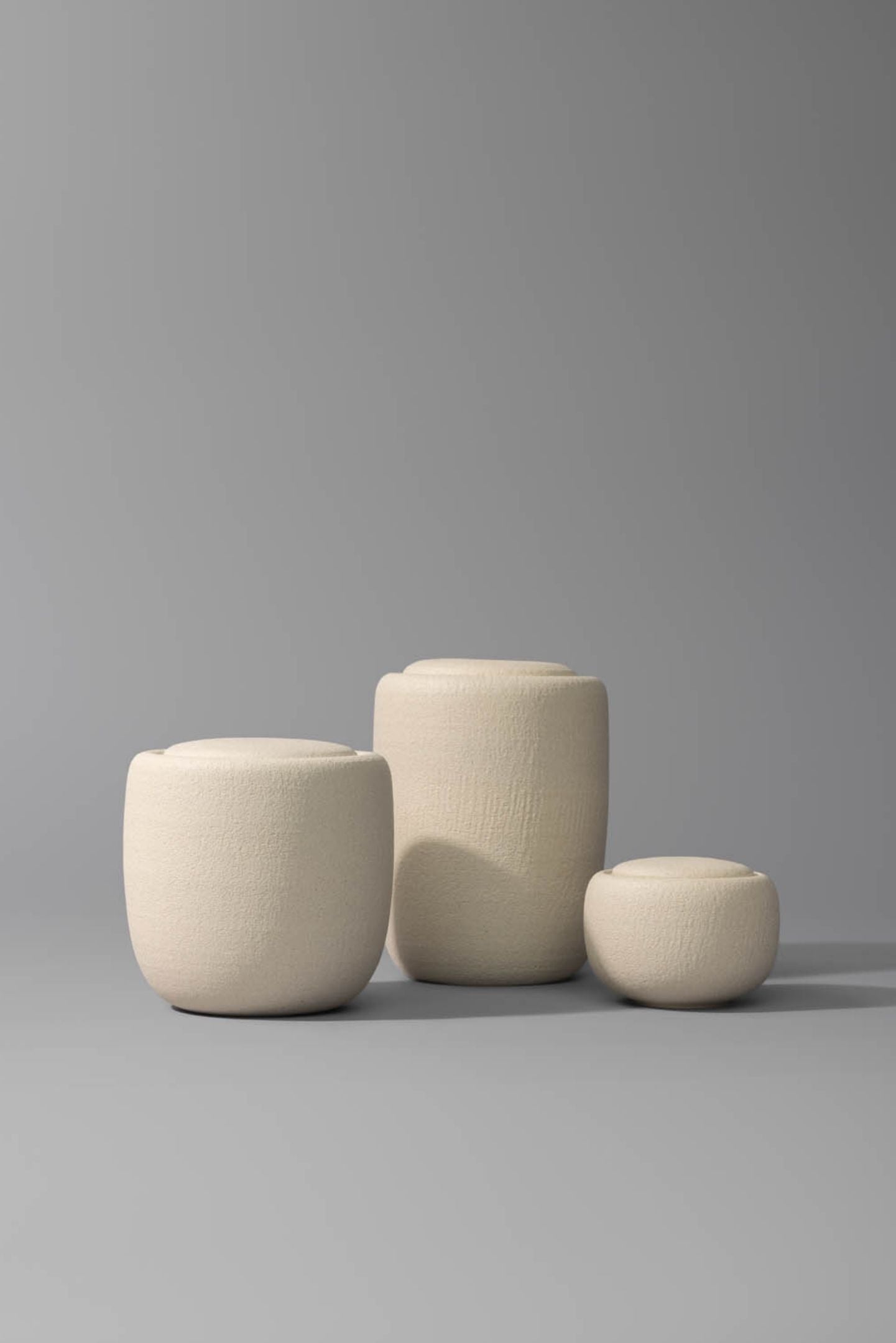 The Vela III ceramic cremation urn alongside other handmade Vela memorial urns as part of a collection.