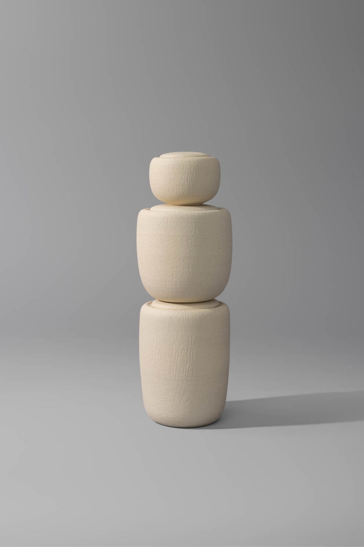 Vela II ceramic cremation urn stacked with other Vela cremation urns.