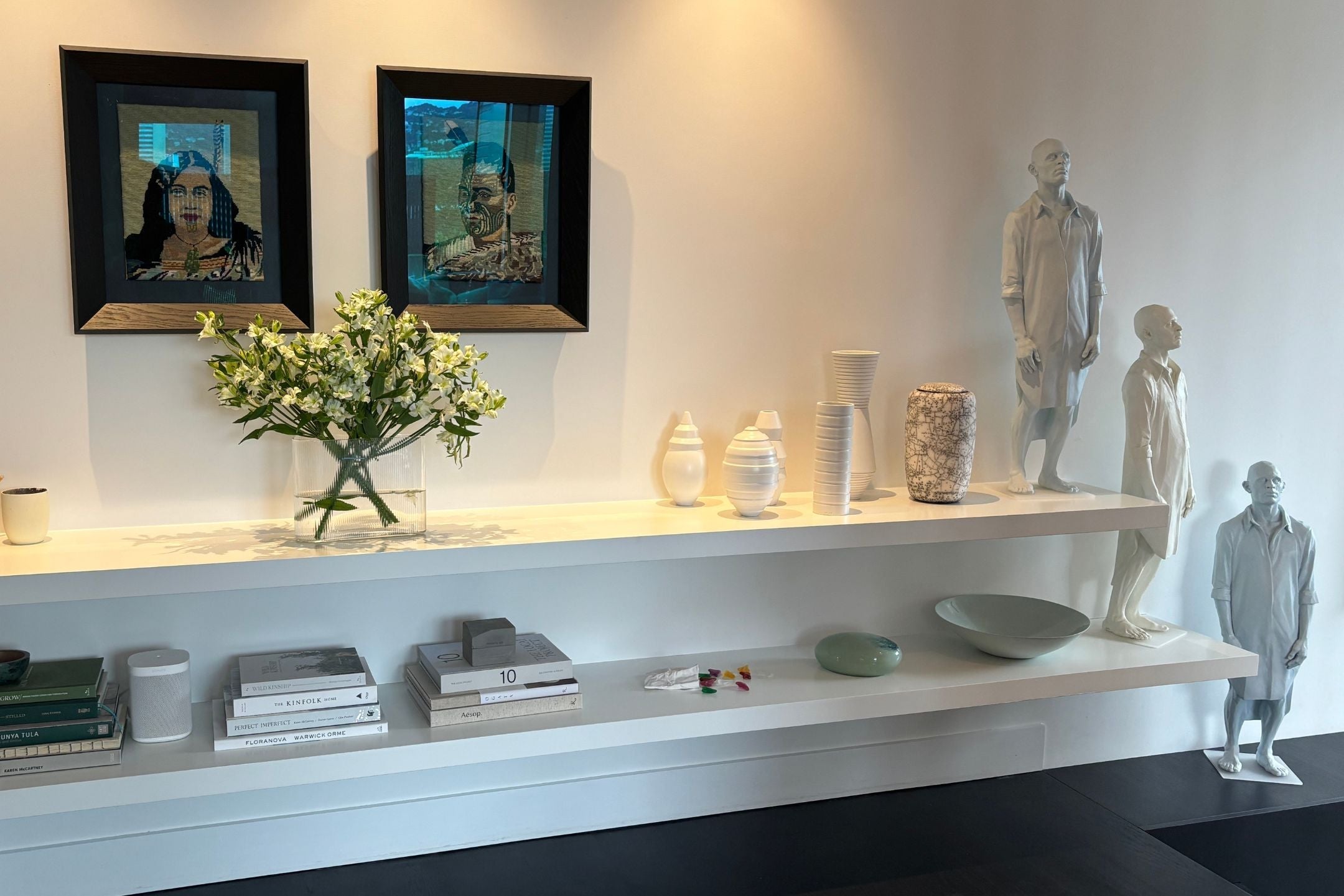 Modern homes showcasing art in unique ways and here, a beautiful Vaso urn sits amongst sculptural pieces from prominent Kiwi artists.