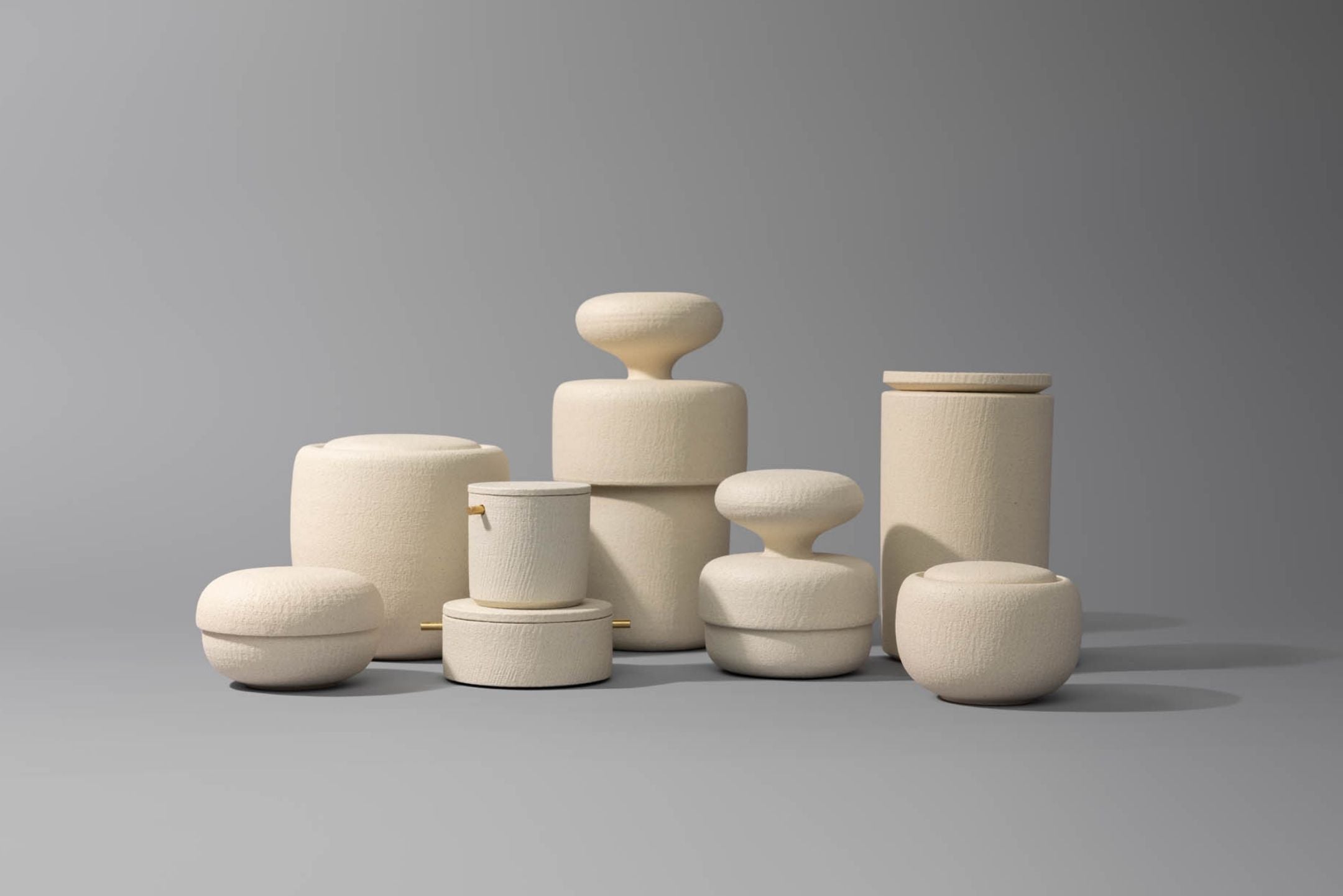 The Vela III ceramic cremation urn surrounded by a collection of handcrafted Vaso cremation urns